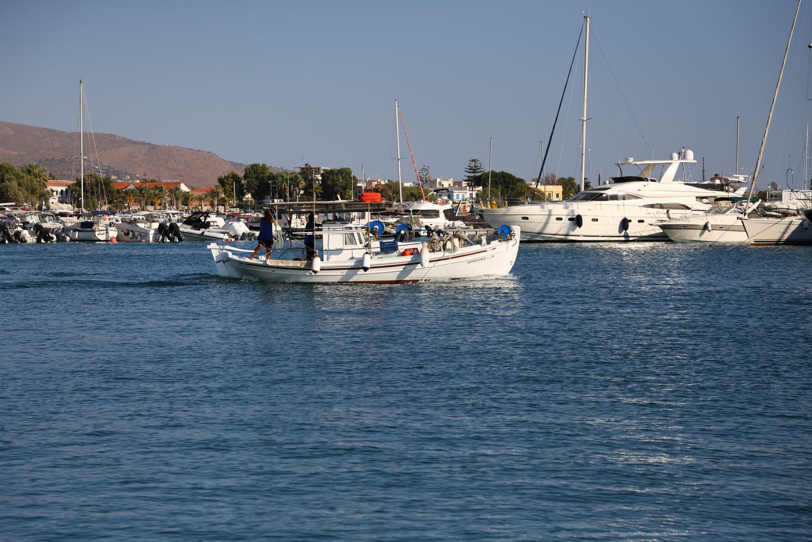 A fishing boat going out of the port of Aegina